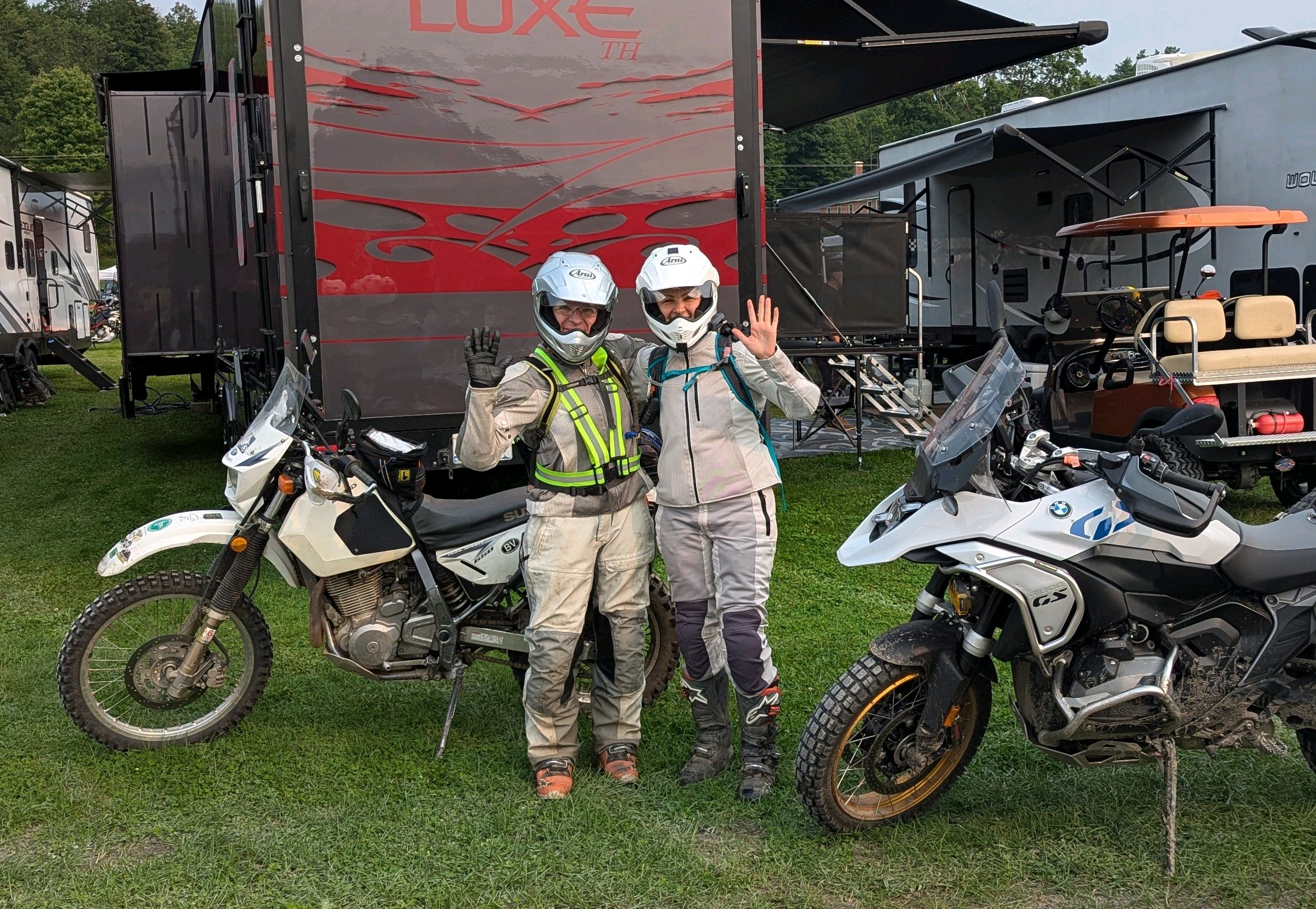 Two women riders waving at Adventure Crown event